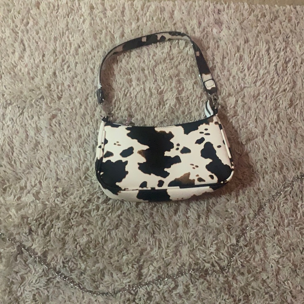 black white and brown cow print purse
